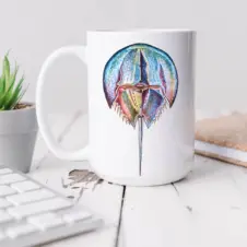 The Ship's Hold Watercolor Artwork 15oz Ceramic Mug, Colorful Horseshoe Crab (individual on table)
