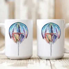 The Ship's Hold Watercolor Artwork 15oz Ceramic Mug, Colorful Horseshoe Crab (pair on table)