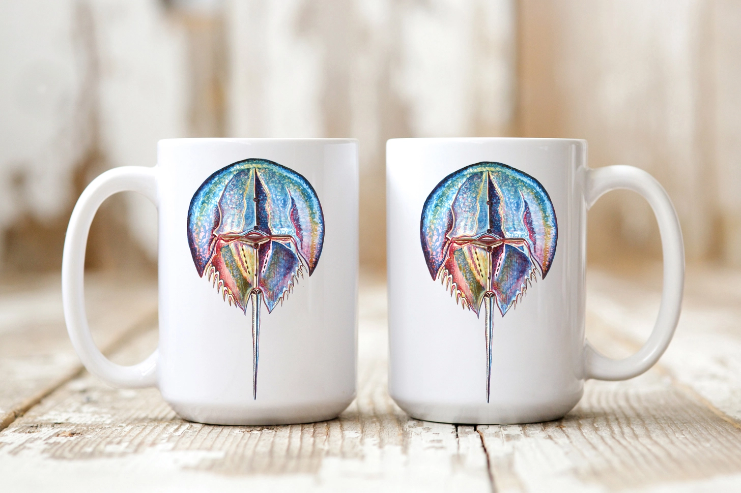 The Ship's Hold Watercolor Artwork 15oz Ceramic Mug, Colorful Horseshoe Crab (pair on table) The Ship's Hold Watercolor Artwork 15oz Ceramic Mug, Colorful Horseshoe Crab (pair on table)