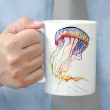 The Ship's Hold Watercolor Artwork 15oz Ceramic Mug, Colorful Jellyfish (individual in hand)