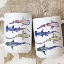 The Ship's Hold Watercolor Artwork 15oz Ceramic Mug, Four Sharks (pair on table)