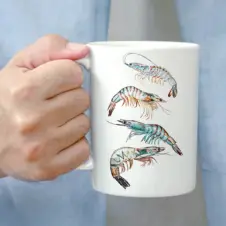 The Ship's Hold Watercolor Artwork 15oz Ceramic Mug, Four Shrimp (individual in hand)