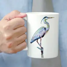 The Ship's Hold Watercolor Artwork 15oz Ceramic Mug, Heron on Branch (individual in hand)