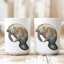 The Ship's Hold Watercolor Artwork 15oz Ceramic Mug, Manatee (pair on table)