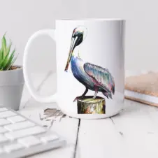 The Ship's Hold Watercolor Artwork 15oz Ceramic Mug, Pelican (individual on table)