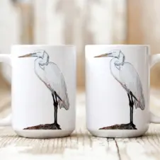 The Ship's Hold Watercolor Artwork 15oz Ceramic Mug, White Egret (pair on table)