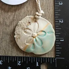 Teal Turtle Studio Ceramic Sandy Sand Dollar Ornament (Image 1)